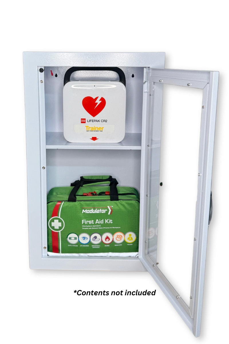 Open view of white wall cabinet showing compartments for defibrillator and first aid kit – contents not included.