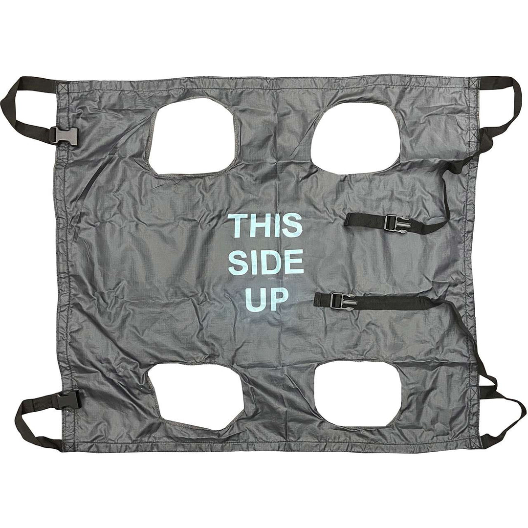 Flat lay of the grey K9 QuikLitter showing cutout handles and “THIS SIDE UP” label.