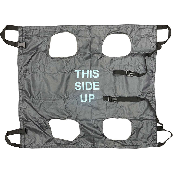 Flat lay of the grey K9 QuikLitter showing cutout handles and “THIS SIDE UP” label.