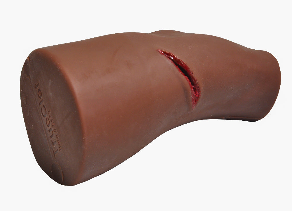 Close-up of deep wound on dark-skin-toned TrueClot PCT3 Task Trainer, without any attachments.