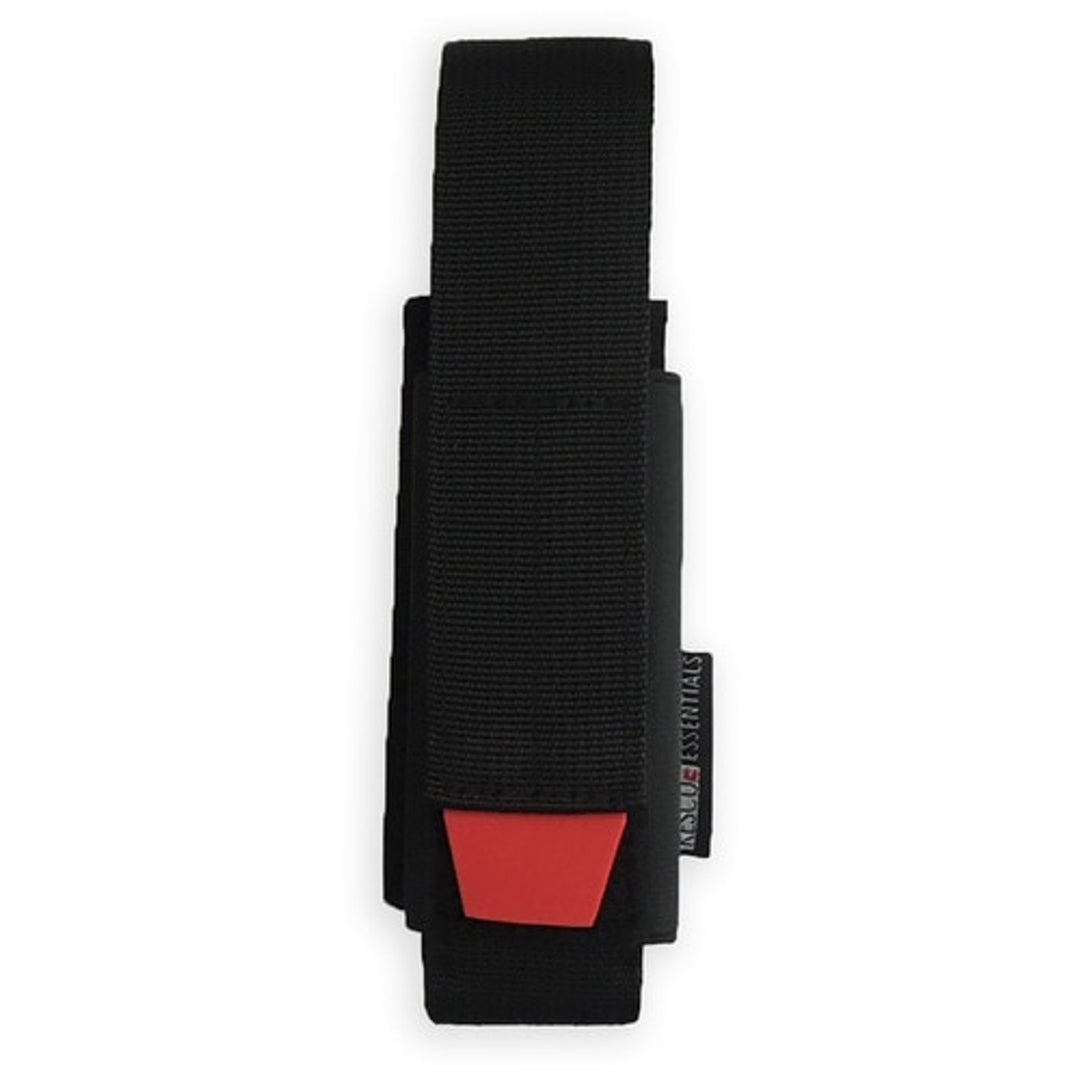 Black universal tourniquet holder with red pull tab, shown upright with MOLLE-compatible strap.
