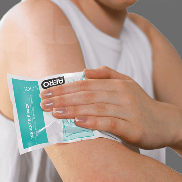 Person applying the activated cold pack to their shoulder