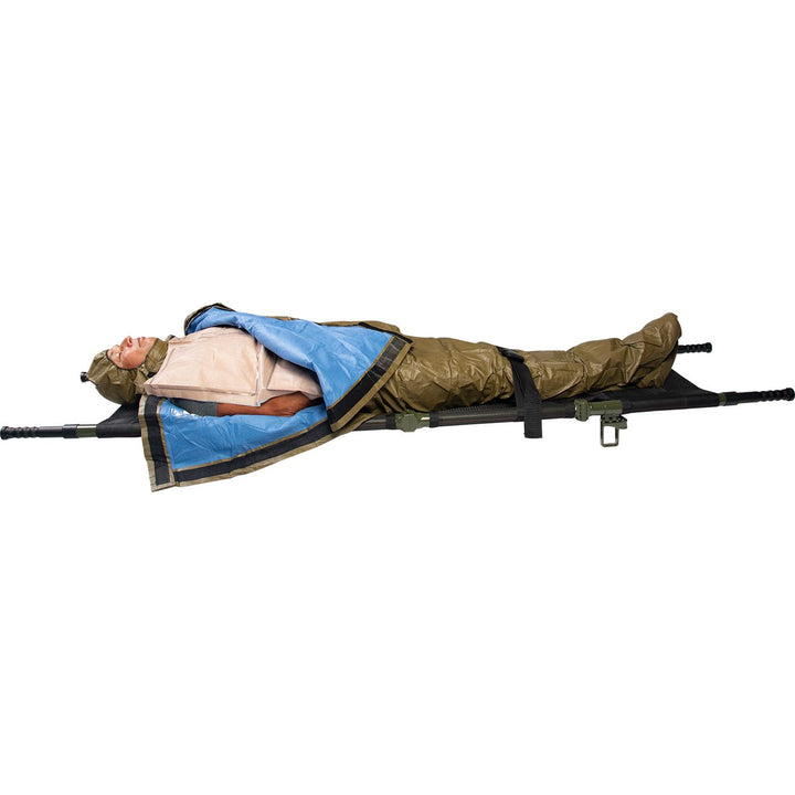 HPMK for the prevention of hypothermia during casualty care, the patented HPMK® with reinforced Heat Reflective Shell is strong, flexible, lightweight & impervious to wind & rain. Image shows a patient wrapped in the HPMK