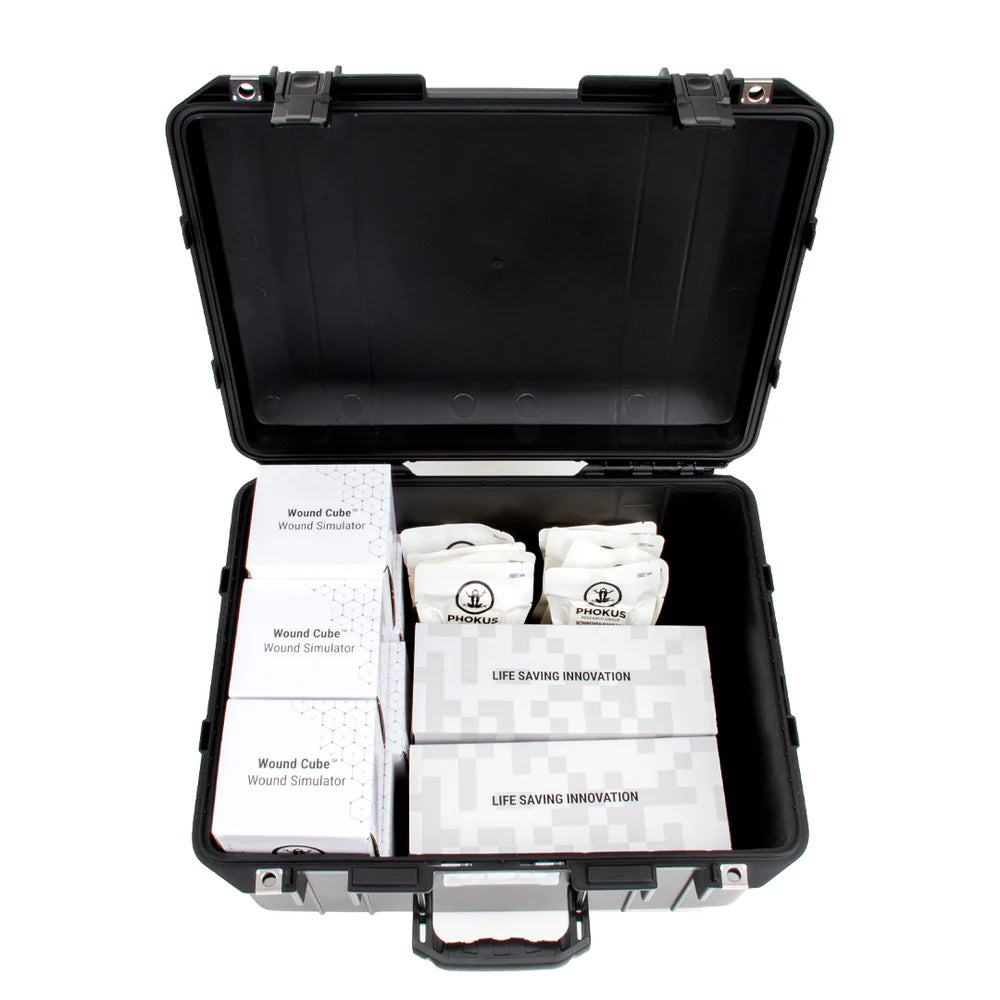 Open travel case containing wound training components