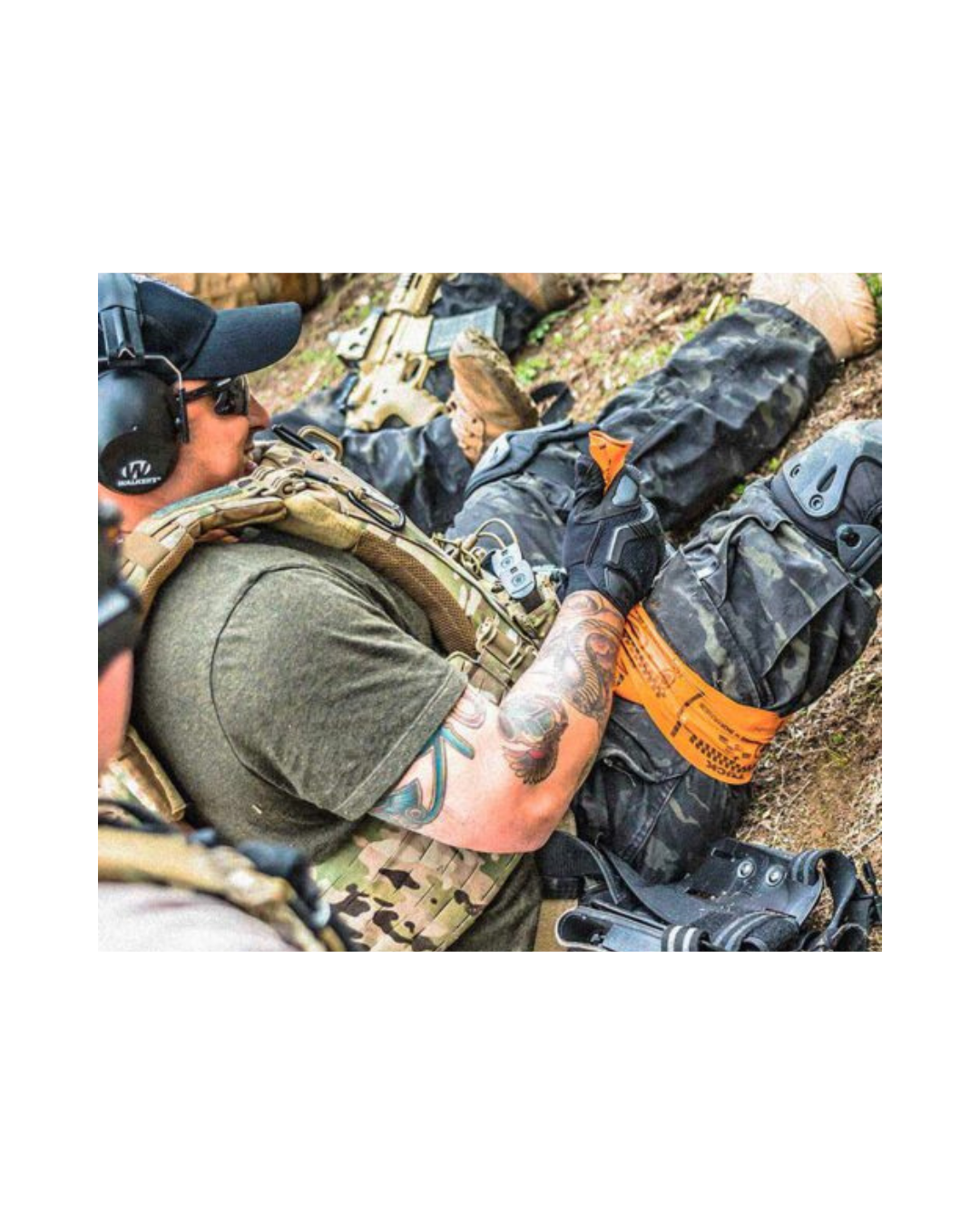 SWAT-T Tourniquet in use, wrapped around a patient’s leg during a tactical field scenario.