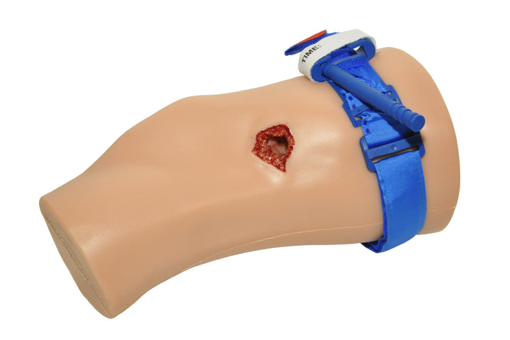 TrueClot PCT3 Task Trainer arm with deep wound and blue tourniquet applied around the upper arm.