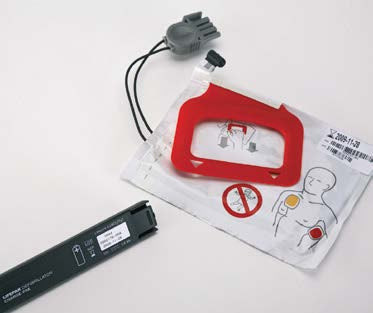 LifePak CR Plus AED replacement kit showing red electrode pad and black CHARGE-PAK battery