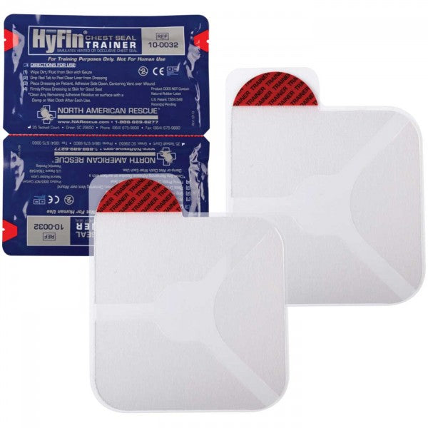 HyFin Chest Seal Trainer Twin Pack showing two individually wrapped blue trainer seals and two unpackaged white practice chest seals with red pull tabs.