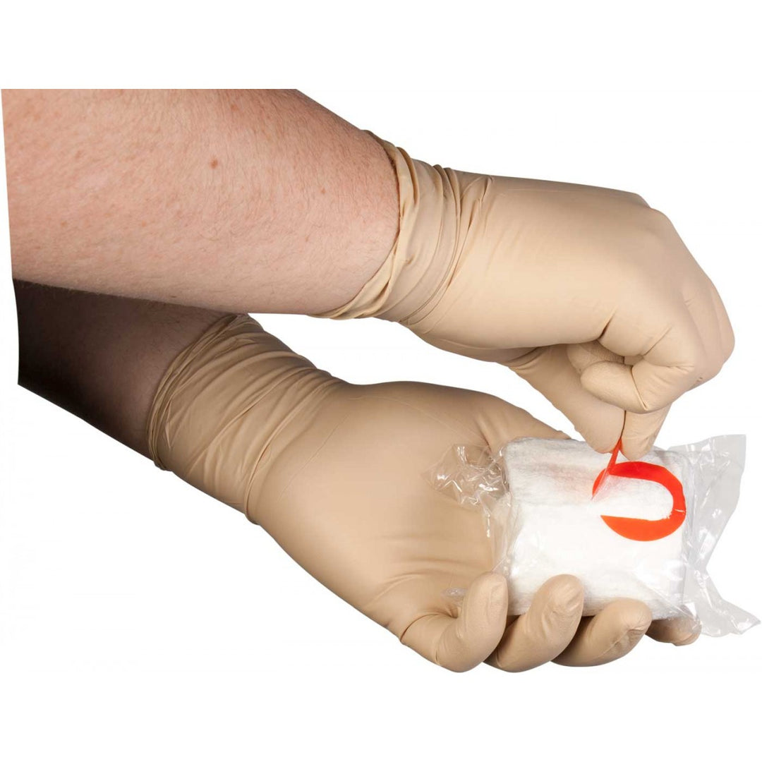 Two gloved hands opening S-Rolled Gauze using red tab. Engineered for clean, efficient access in time-critical medical interventions. TacMed Australia – reliable gauze for trauma kits.