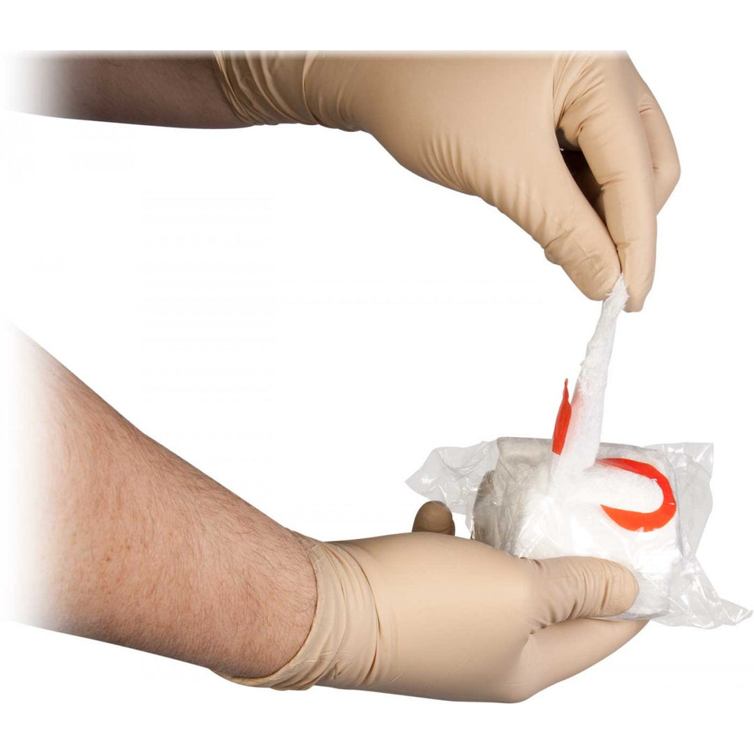 Gloved hands extracting S-Rolled Gauze from vacuum seal using red tab. Designed for quick wound packing and bleeding control. TacMed Australia – professional-grade gauze for emergency responders.