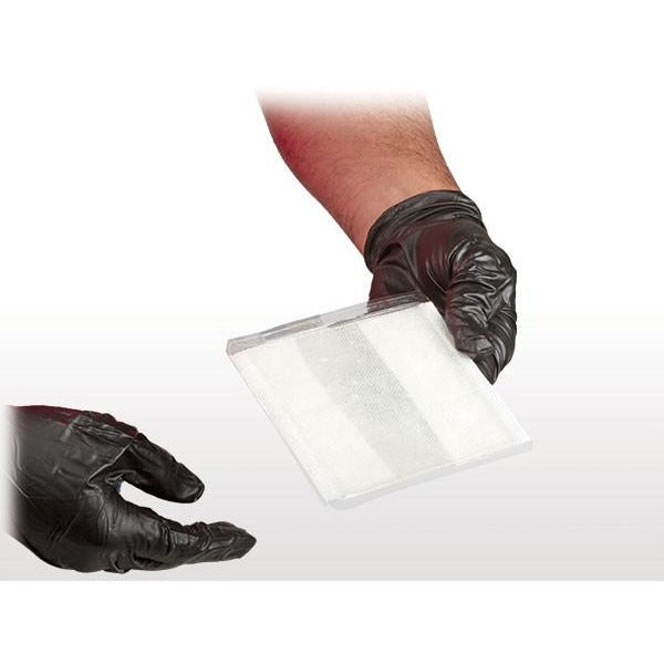 Gloved hands peeling BurnTec dressing open from protective layer. Built for sterile, easy field application. TacMed Australia – trauma-approved burn relief solution.