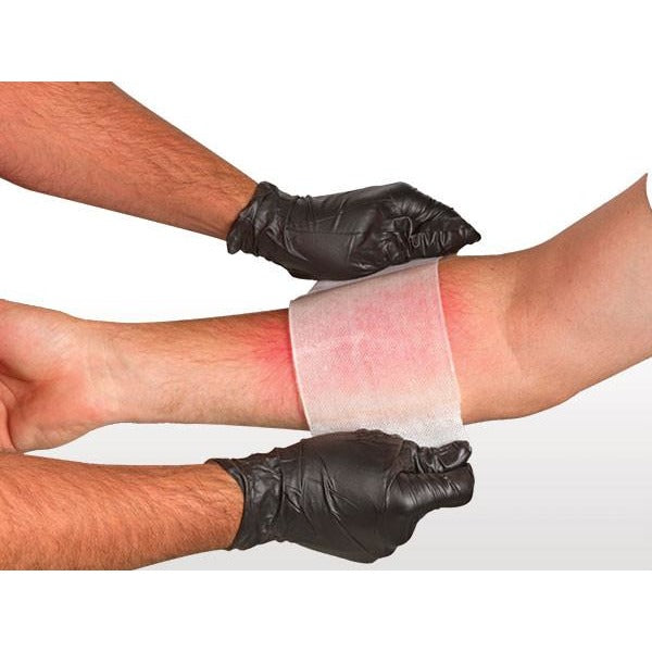 BurnTec large facial burn dressing next to product pack. Designed to fit face contours for full coverage. TacMed Australia – critical burn care solution for EMS and responders.