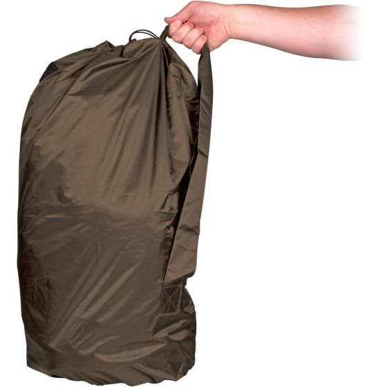 Compressed brown casualty bag being held upright by one hand.