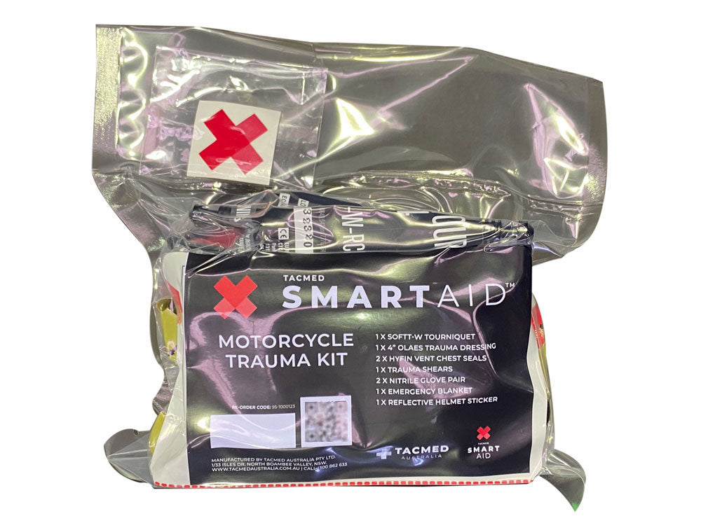 TacMed SmartAid Motorcycle Trauma Kit sealed in a silver vacuum pouch with red cross and product label.
