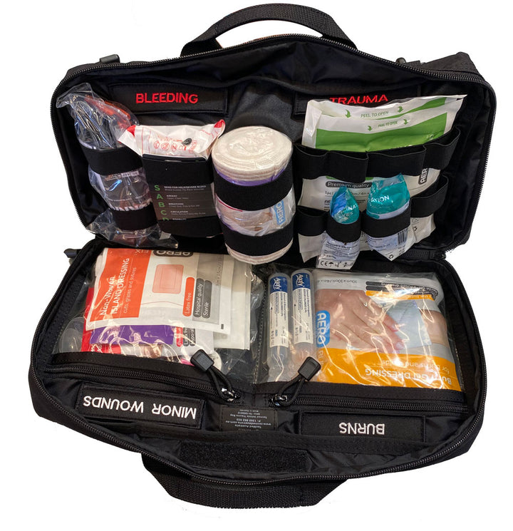 TacMed Vehicle Trauma Kit opened to show clearly labelled compartments for bleeding, burns, and minor wounds. Packed with premium medical supplies. Ideal for cars, 4WDs, and emergency responders.
