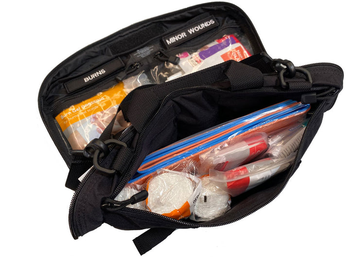 Side view of TacMed Vehicle Trauma Kit showing organized internal layout and stocked medical compartments. Optimised for vehicle-based first aid.