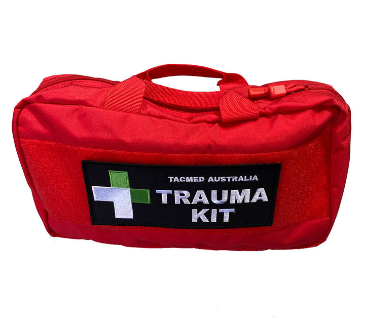 Red soft trauma bag with 'TRAUMA KIT' patch and TacMed Australia logo. Designed for fast identification and access in vehicle emergencies.