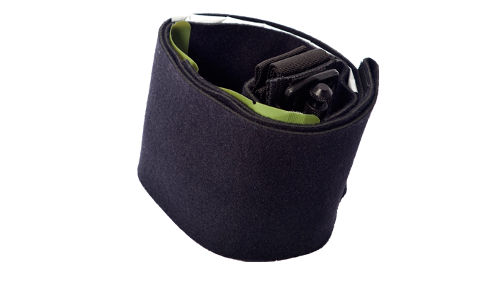 Rolled-up ankle medical kit showing internal compartments and stored medical supplies.