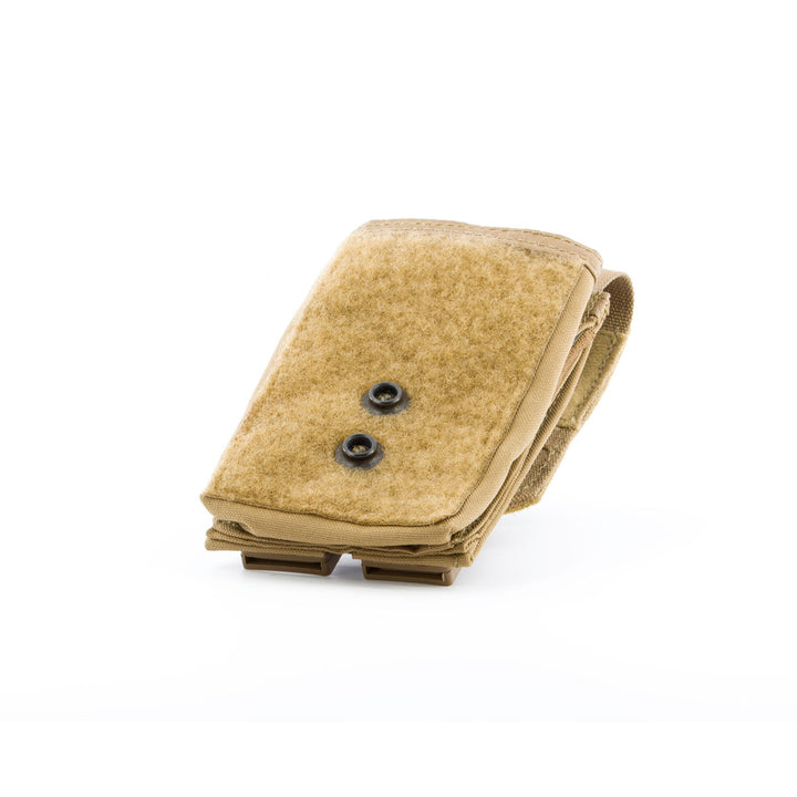 Compact tan SABA pouch with secure snap closure, front view.