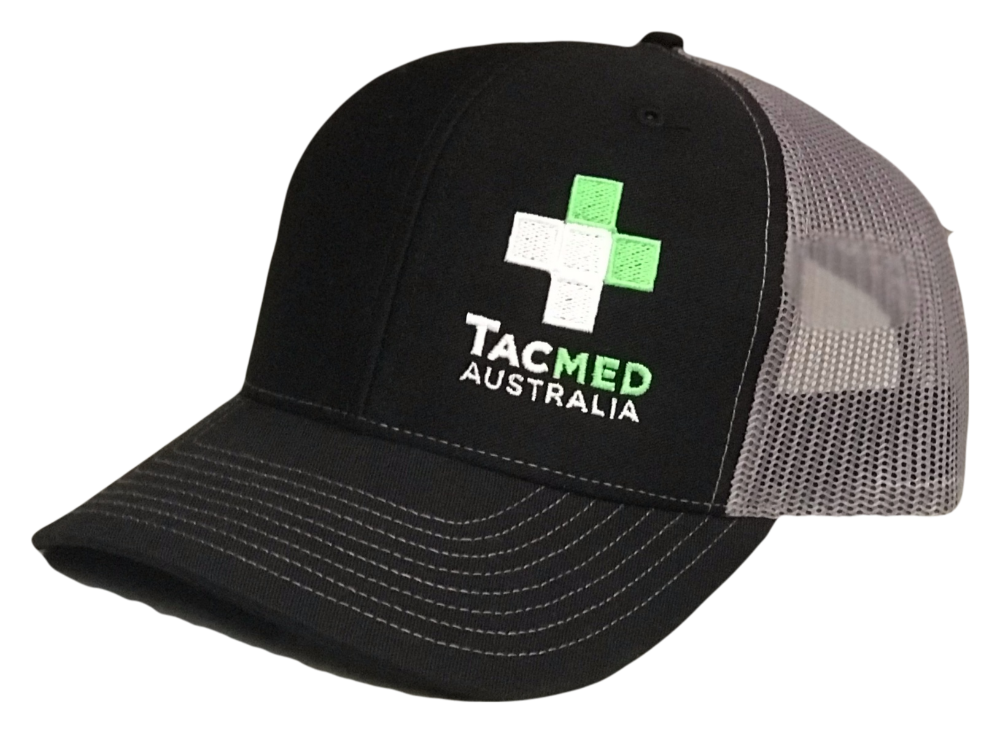 Black and grey TacMed Australia trucker cap with embroidered green and white cross logo on the front.