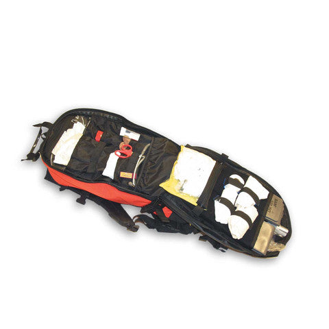 Top-down view of the pack opened flat, revealing multiple storage pockets and trauma gear layout.