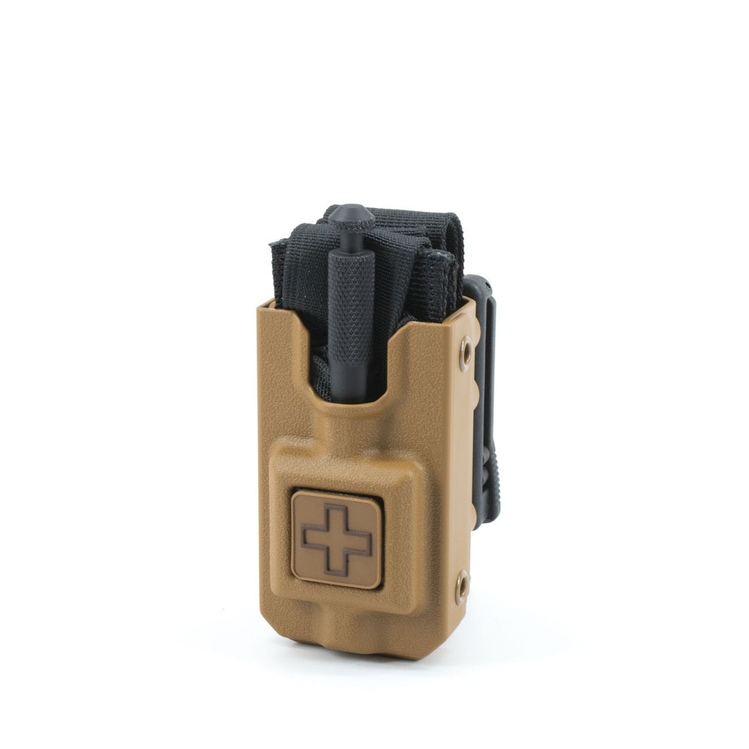 Eleven 10 RIGID TQ Case in coyote brown with tourniquet partially inserted. Injection-molded case designed for fast, one-handed access. TacMed Australia – rugged TQ holder for law enforcement and tactical medics.