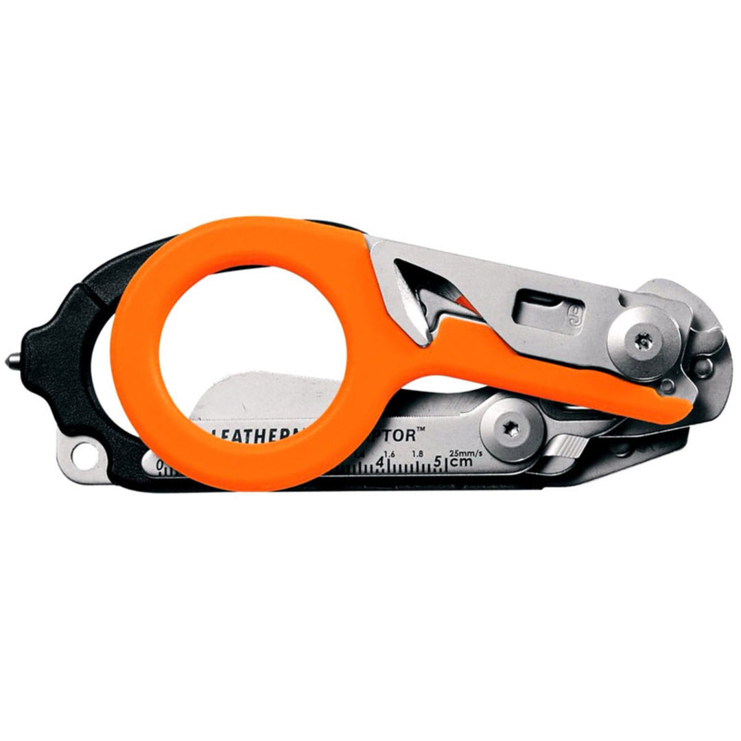 Leatherman Raptor with orange handle folded for compact storage. Designed to fit inside included utility holster. TacMed Australia – foldable trauma shears with built-in safety tools.