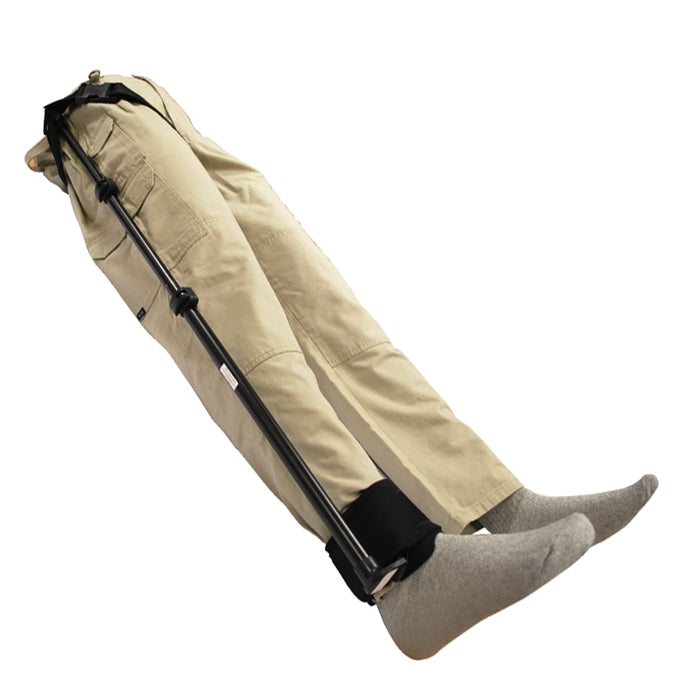 Slishman traction splint applied to a simulated leg injury with pants and socks visible.