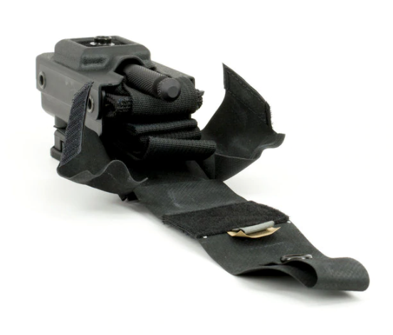Open view showing a SOF®TT tourniquet partially removed from the case with retaining strap visible.