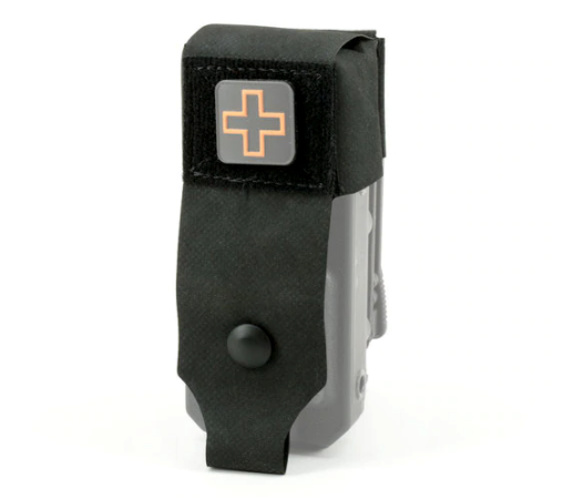 Front view of the black Eleven 10 RIGID TQ Case Jacket with a cross patch on the flap.