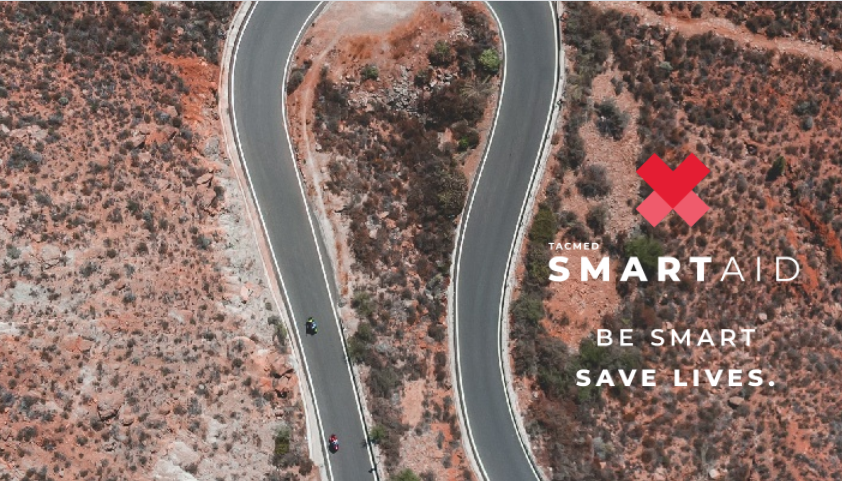 Overhead view of an outback road with the TacMed SmartAid Motorcycle Trauma Kit promotional graphic overlaid.