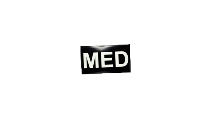 Black rectangular patch with bold white 'MED' text, glow-in-the-dark design, displayed on a white background.