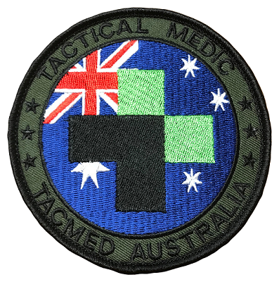 Circular Tacmed Australia patch featuring the Australian flag and green cross on a blue background with black border text that reads 'Tactical Medic – Tacmed Australia.