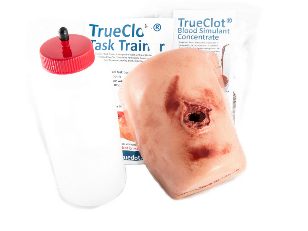 TrueClot Wound Packing Task Trainer displayed in front of product packaging with included training components.