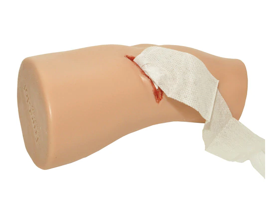 TrueClot PCT3 Task Trainer with gauze fully inserted into the wound, top-down angle.