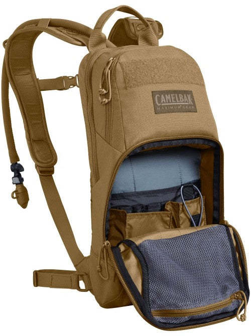 Coyote brown CamelBak M.U.L.E. 3L with compartments open showing gear storage.