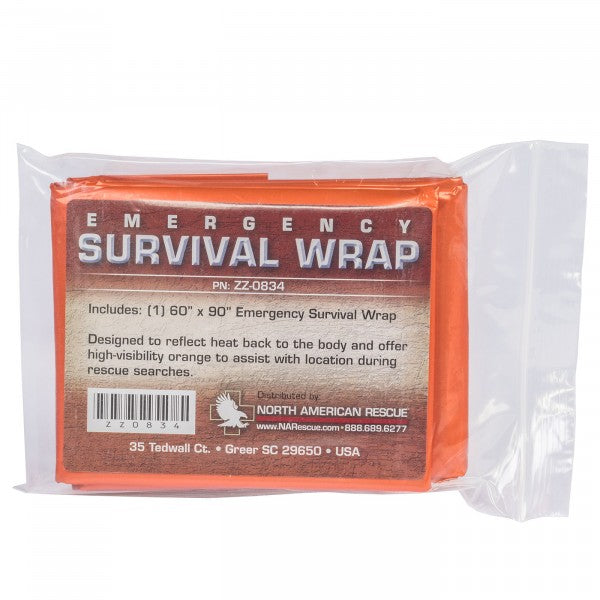 Vacuum-sealed orange North American Rescue Emergency Survival Wrap in clear plastic packaging with printed usage instructions.