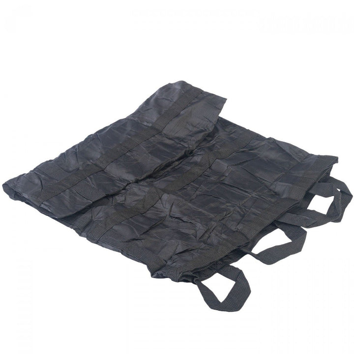 Compactly folded QuikLitter Lite with visible carry handles tucked underneath.