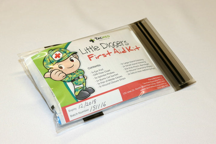 Angled view of the resealable Little Diggers First Aid Kit showing the label and compact packaging.