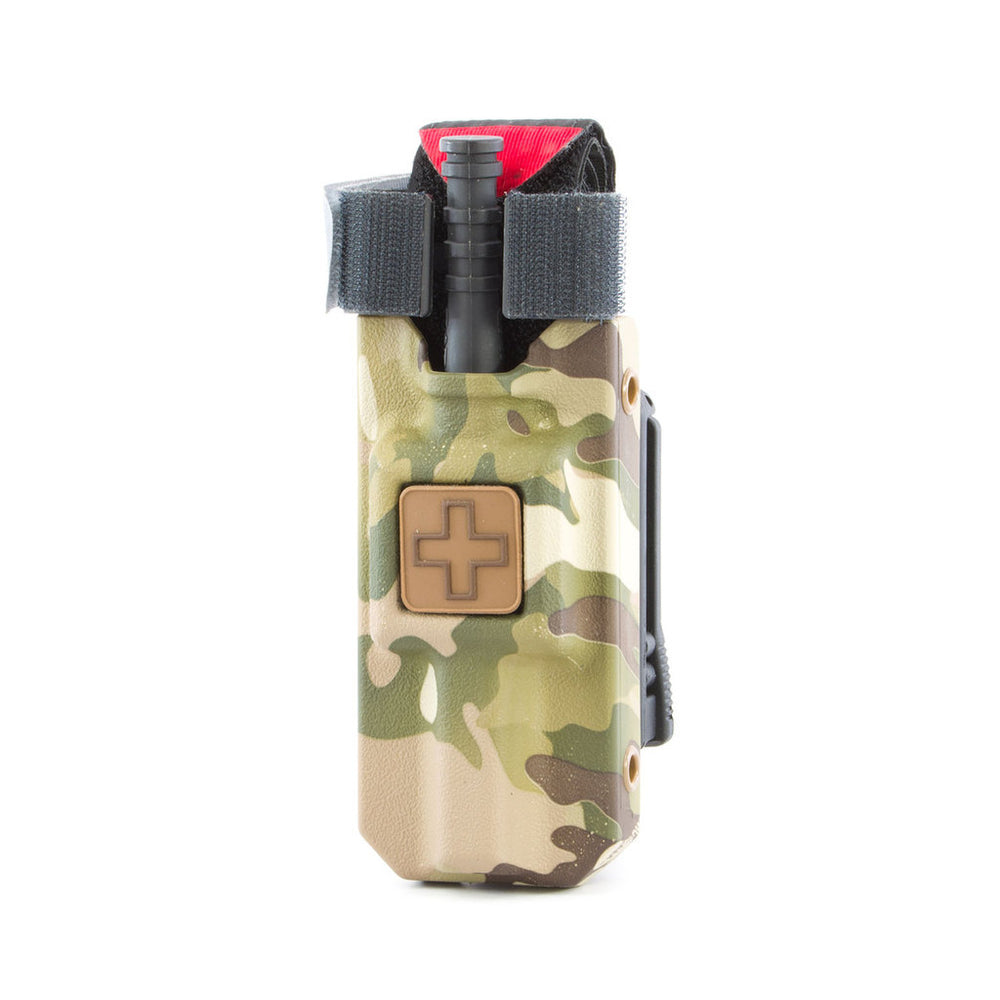 Multicam RIGID TQ Case with orange medical cross. Designed to securely carry C-A-T® tourniquets on MOLLE or belt systems. TacMed Australia – camouflage TQ holster for field-ready operators.
