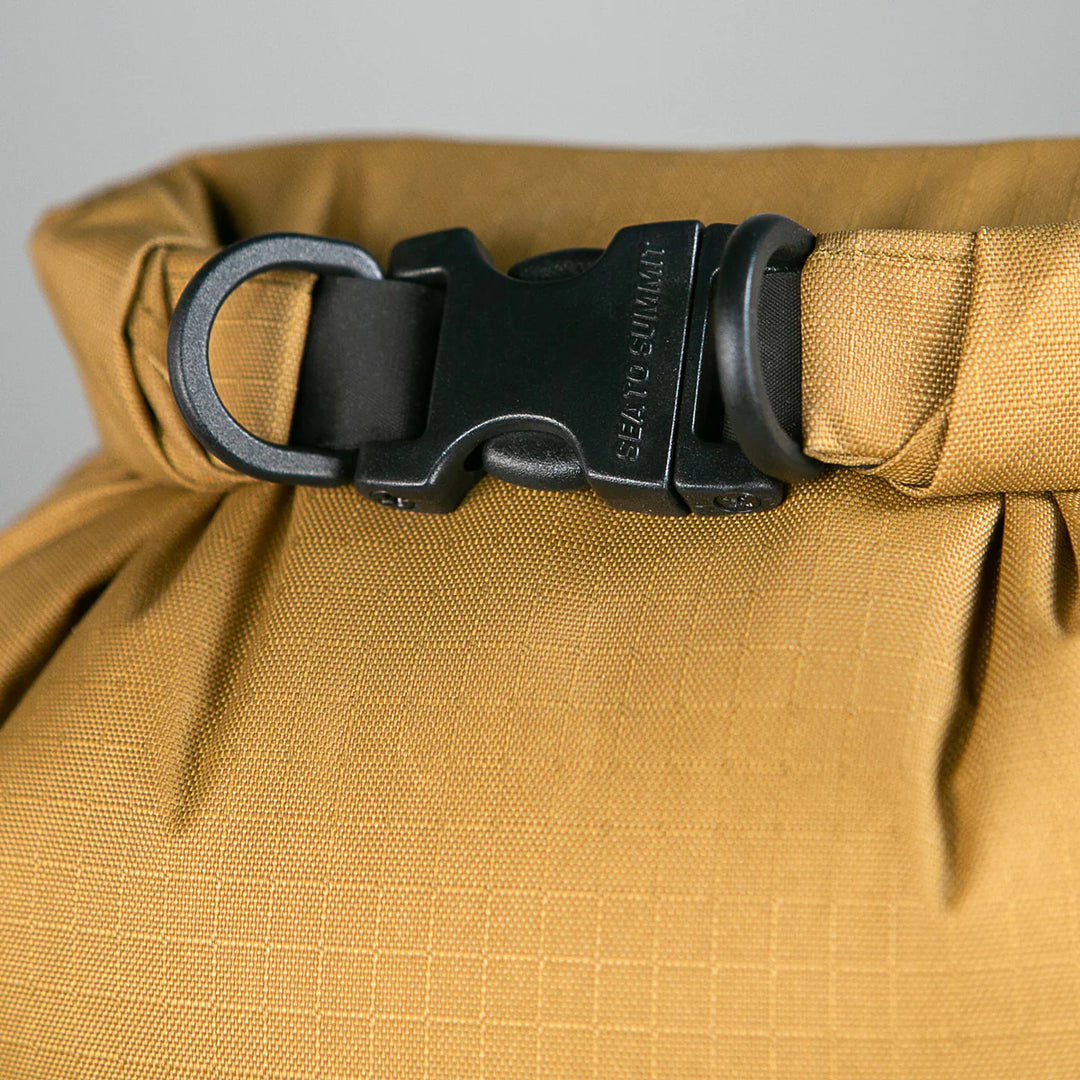 Close-up of roll-top closure and side buckle

