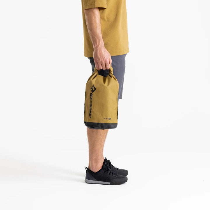 Bag held at side for size reference against leg

