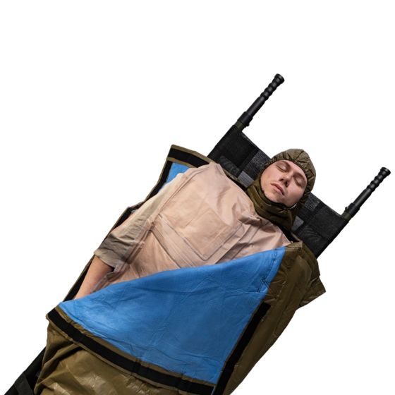 HPMK-I™ (Insulated) with Reinforced Heat Reflective Shell in use, showing a person wrapped in a tan and blue insulated blanket on a stretcher. Features a self-heating 4-Cell Ready Heat® blanket and hook-and-loop closures, designed for thermal retention in emergencies.
