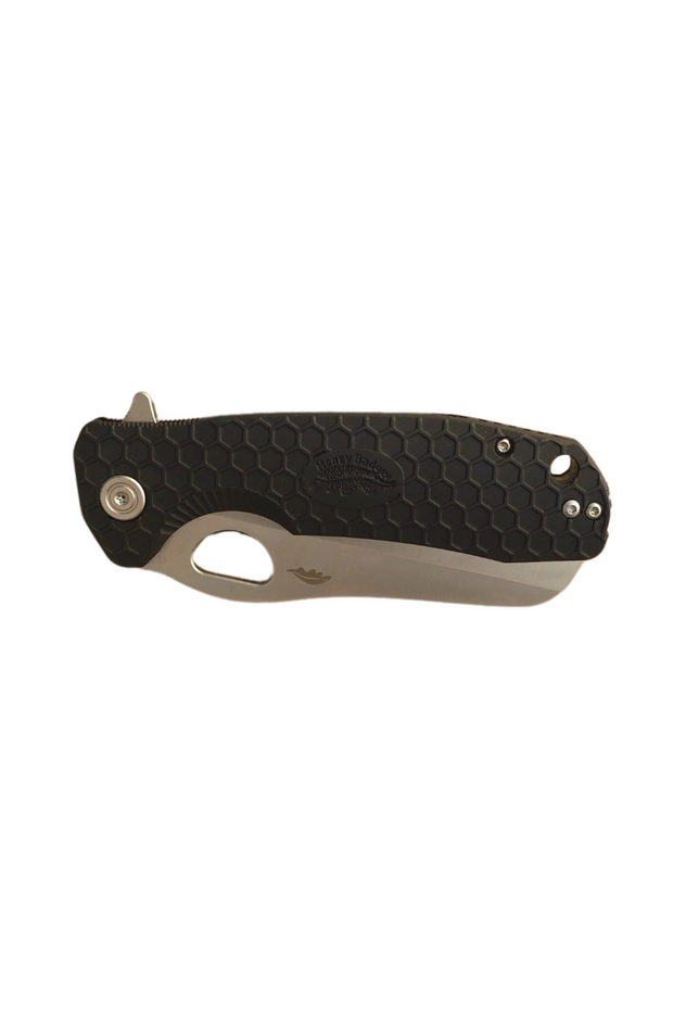 Black Honey Badger rescue knife in closed position showing front side with textured handle and silver hardware