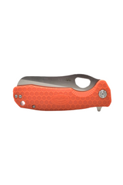 Orange Honey Badger rescue knife in closed position showing front side with textured handle and silver hardware