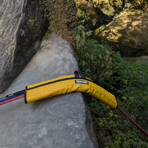 Slider in use on stone edge during rope rescue

