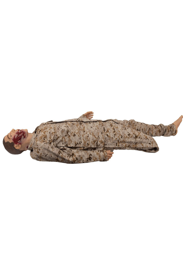 TOMManikin Blast wearing a camouflage army uniform and revealing an amputated leg and severe blast wound on his face