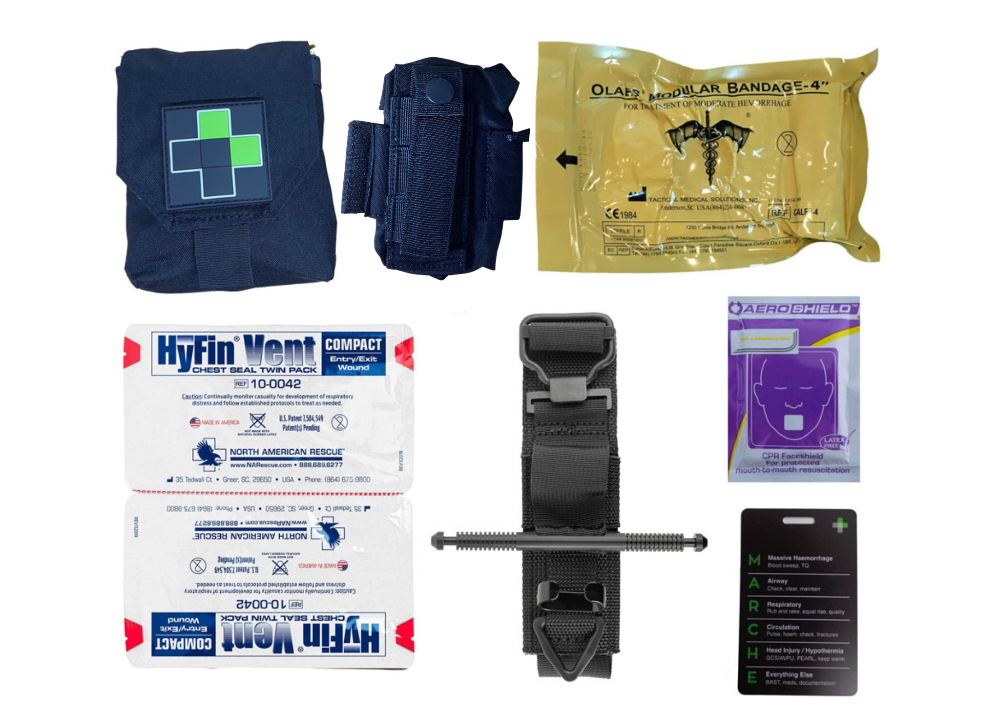 Flat lay of the TacMed Split IFAK contents including a black tourniquet, combat gauze, emergency trauma dressing, gloves, and various first aid supplies arranged beside the open pouches.