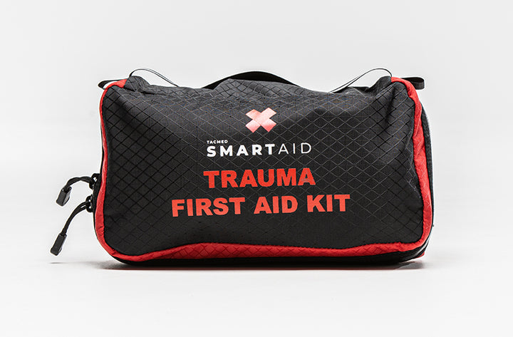 Black and red TacMed SmartAid Trauma First Aid Kit bag with carry handles and bold front labeling.