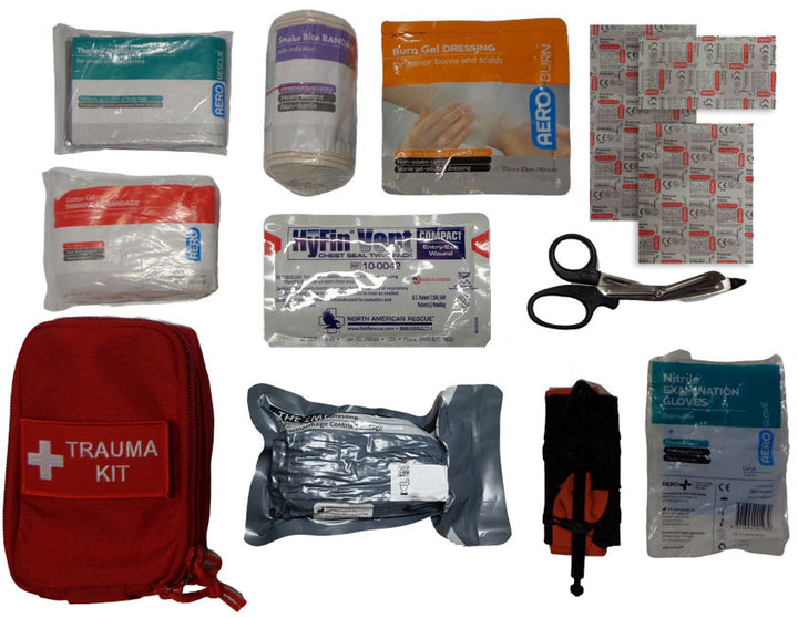Red Community First Responder Trauma Kit pouch with white cross and TRAUMA KIT label, designed for rapid access in emergencies. Includes essential first aid supplies for bleeding, airway, and wound care.